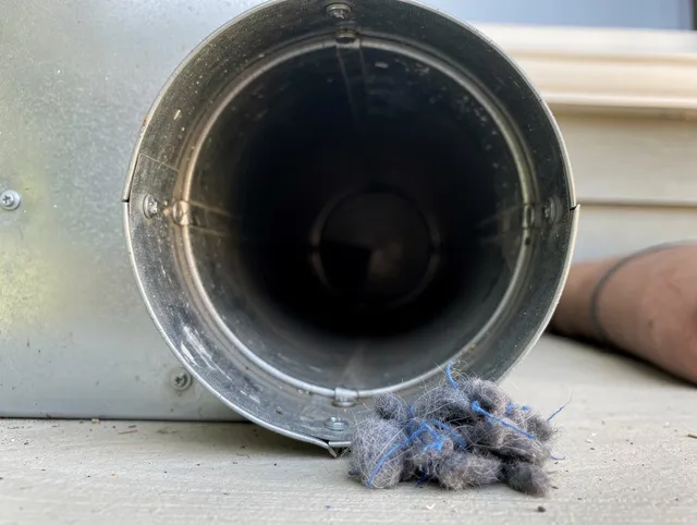 View Park-Windsor Hills Dryer Vent Cleaning technician using specialized equipment to clear severe dryer vent blockage in View Park-Windsor Hills